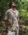 Man wearing Botanical Shirt Gray eco-printed with natural leaves and dyed with myrobalan, handmade in Auroville