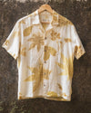 Botanical Shirt in natural white hanging outdoors, eco printed with foraged leaves on cambric cotton.