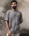 Model wearing a slate botanical t-shirt, front view