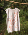Front view of orange bamboo top showing block printed patterns and natural drape