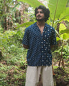 Man wearing Indigo Shirt Dots, hand block-printed with indigo using traditional Dabu technique in Auroville, India